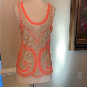 Gorgeous sheer and sleeveless top.